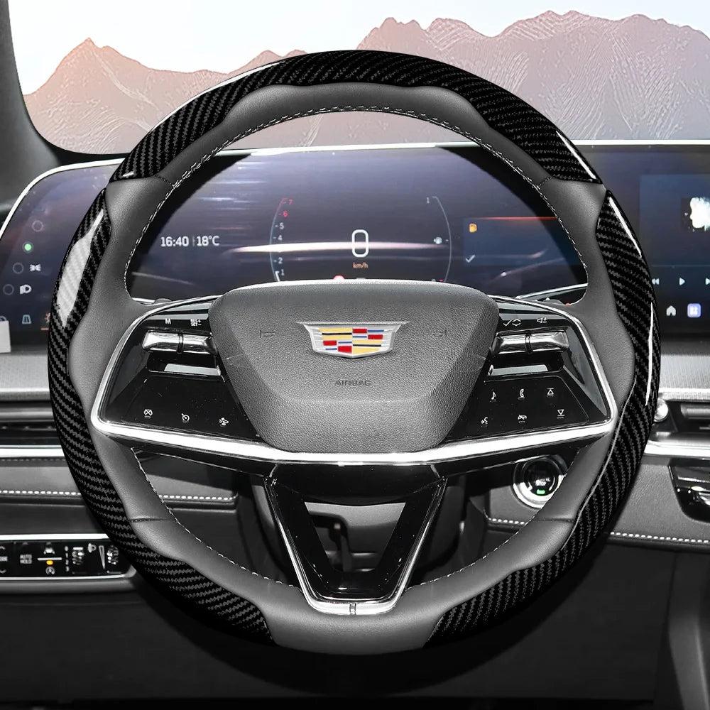 Close-up view of a sporty carbon fiber steering wheel cover inside a car cockpit.