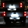 Rear view of a truck showing high-intensity LED license plate lights illuminated.