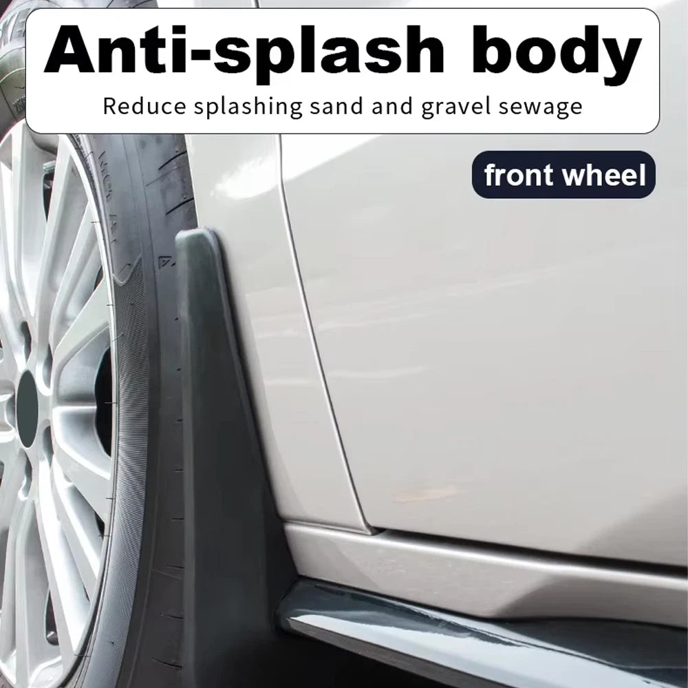 Close-up of an anti-splash body mud flap installed on the front wheel of a white vehicle.