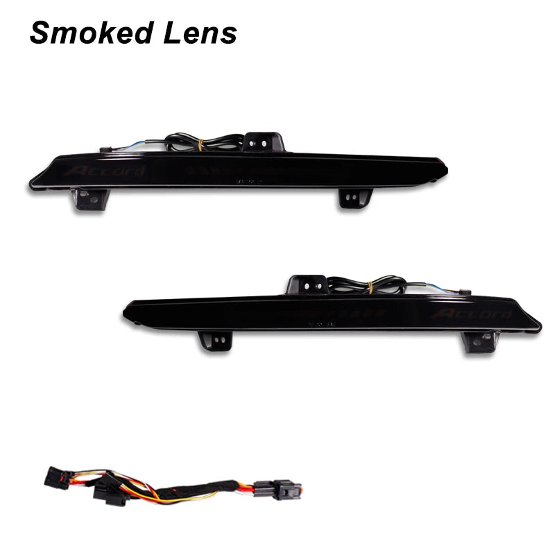 A black smoked lens LED bumper reflector light assembly for a Honda Accord.