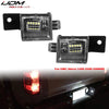 OEM style license plate lights for GMC Sierra trucks shown next to the replacement module.