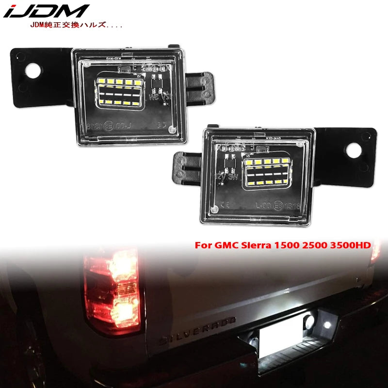 OEM style license plate lights for GMC Sierra trucks shown next to the replacement module.
