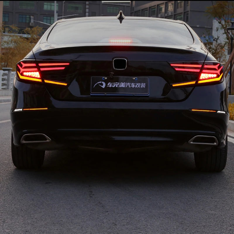 Rear view of a black Honda Accord with aftermarket LED bumper reflector lights installed.