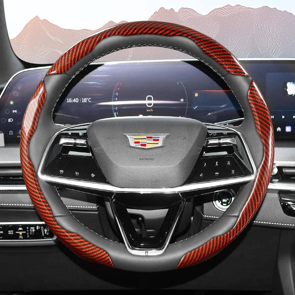 Close-up view of a sporty carbon fiber steering wheel cover inside a car cockpit.
