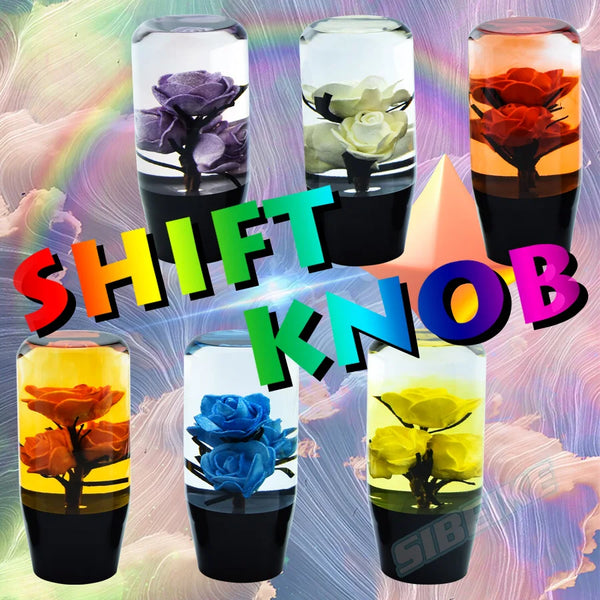 A collection of crystal flower gear shift knobs in various colors including purple, green, orange, and blue.