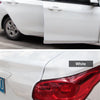 Close-up of a white car door edge protector trim on the side and rear lights.