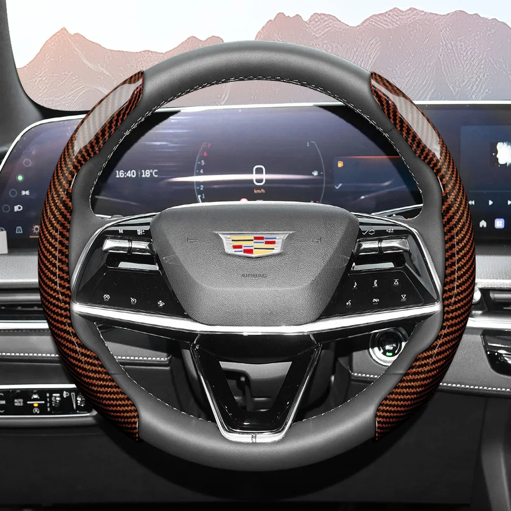 A close-up view of a sporty carbon fiber steering wheel cover inside a modern car cockpit.