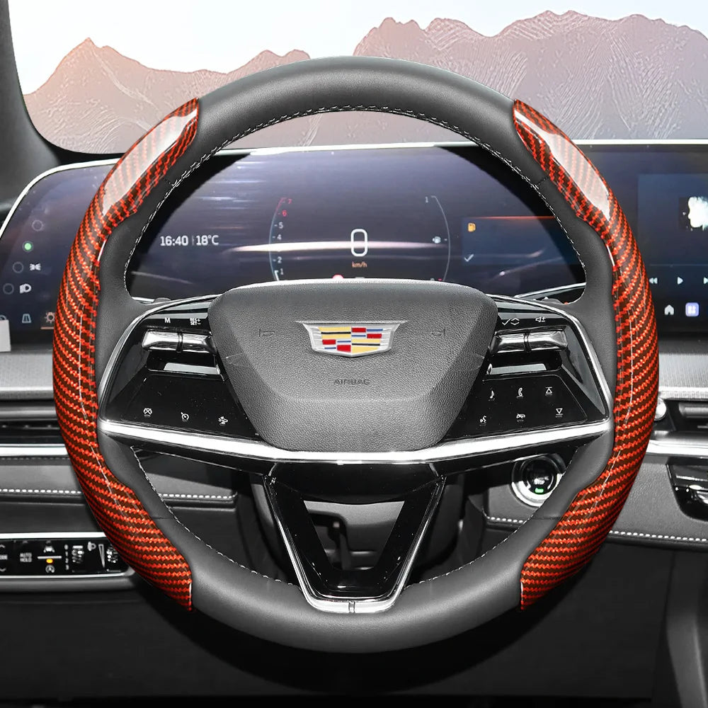 A close-up view of a sporty carbon fiber steering wheel cover inside a car cockpit.