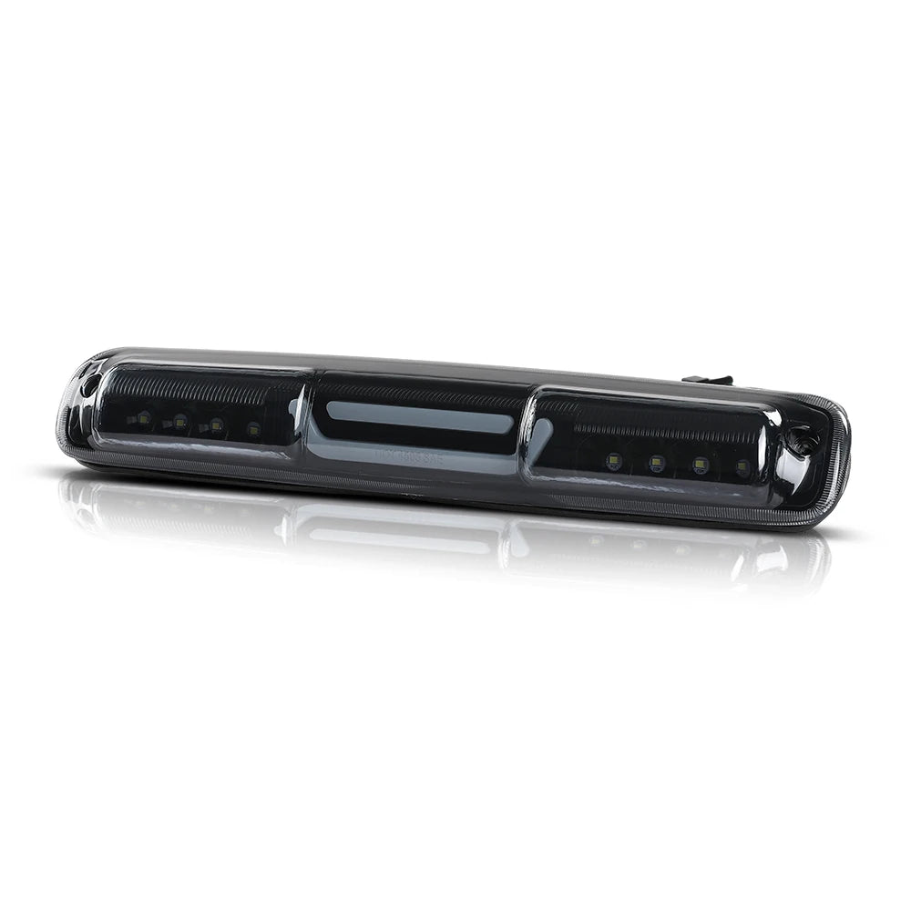 A black high-mount third brake light for a Chevy Silverado or GMC Sierra truck.