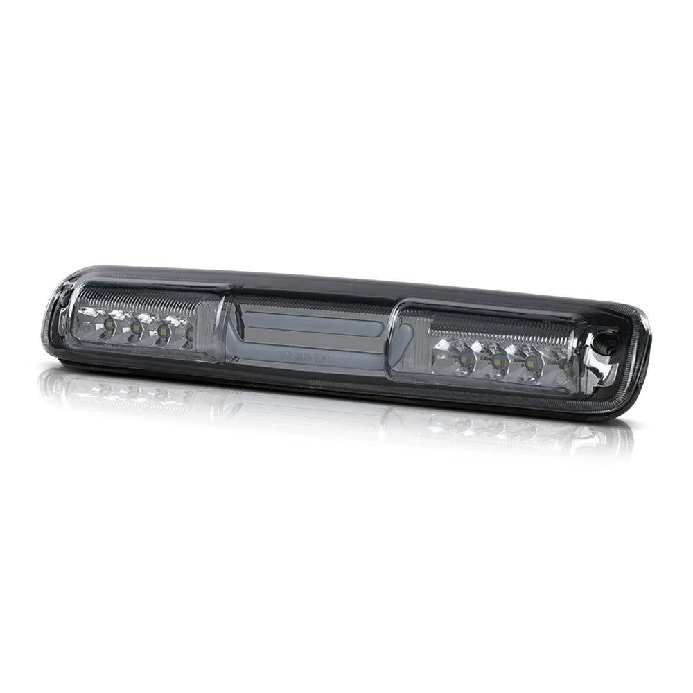 A clear high-mount third brake light assembly for a Chevy Silverado or GMC Sierra truck.