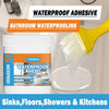 A yellow brush applies waterproof adhesive sealant to a bathroom surface for waterproofing sinks, floors, showers, and kitche