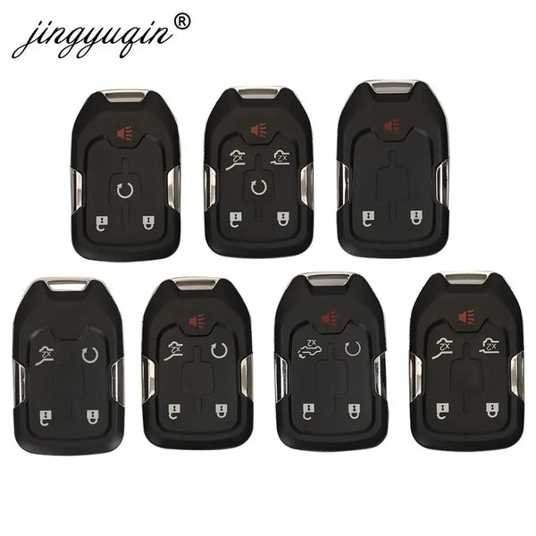 A set of black universal car key fob shell replacements with various electronic components.