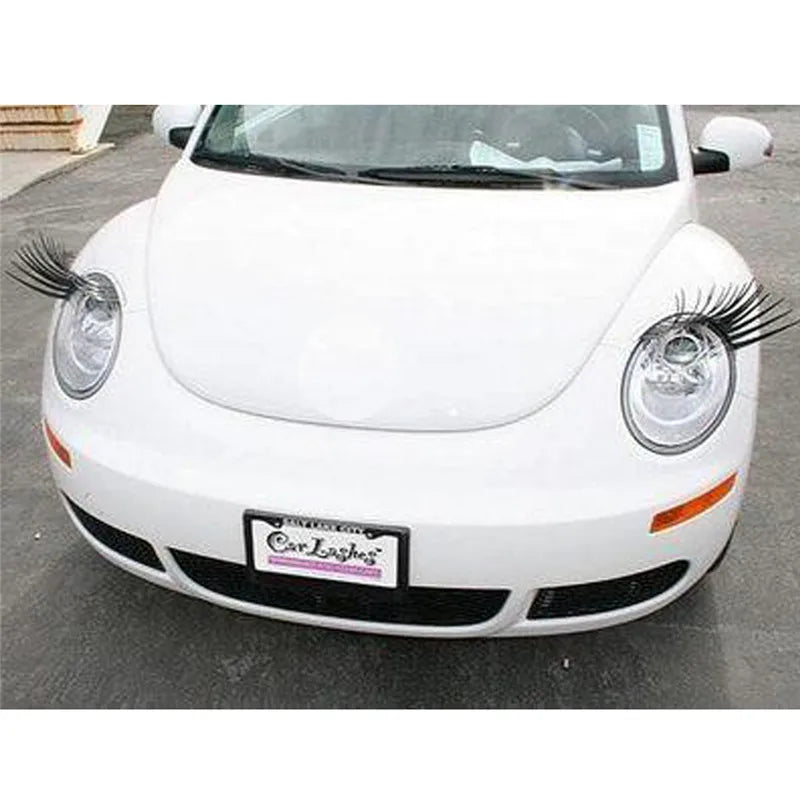 A white Porsche headlight with black eyelash sticker sets installed on the front lens.