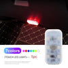 A white mini wireless LED touch light is mounted on a dark interior surface, illuminating the surrounding fabric.
