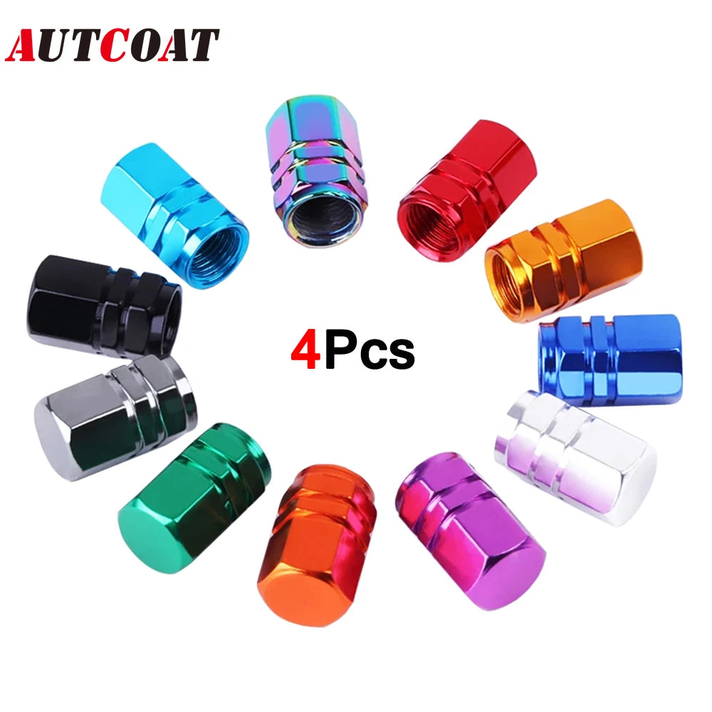 Cuatro tapones de válvula de llanta de aluminio coloridos en varios acabados y ángulos.