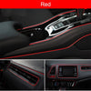 Close-up view of red universal car moulding trim strips and interior components in a car dashboard.