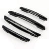 A set of four black car door edge protector strips for anti-scratch guard trim.