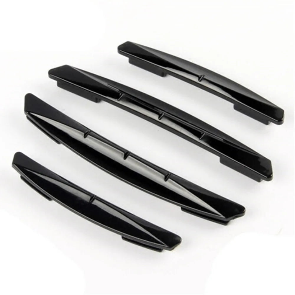 A set of four black car door edge protector strips for anti-scratch guard trim.