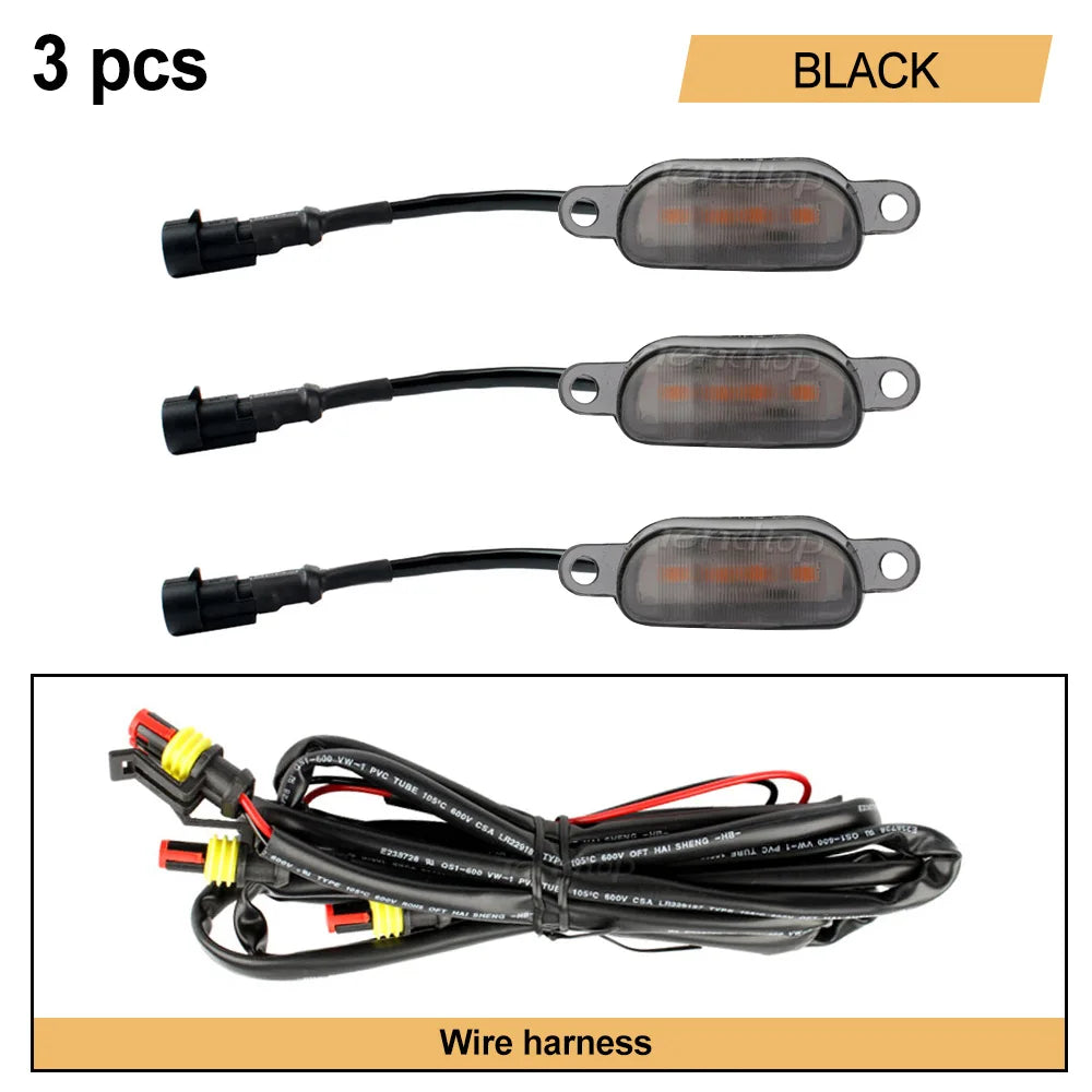 Black LED light kit with wire harness for vehicle front grille marker lights