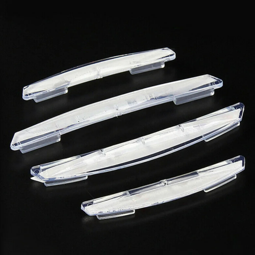A set of four clear plastic car door edge protector strips for anti-scratch guard trim.