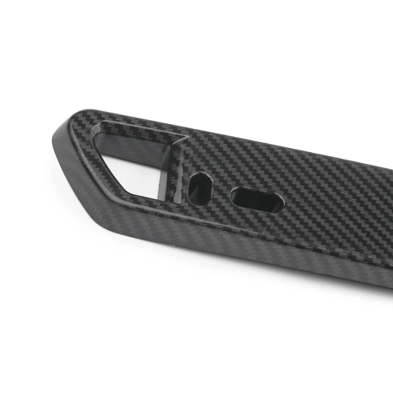 A black carbon fiber adjustable universal car license plate holder with a rectangular opening.