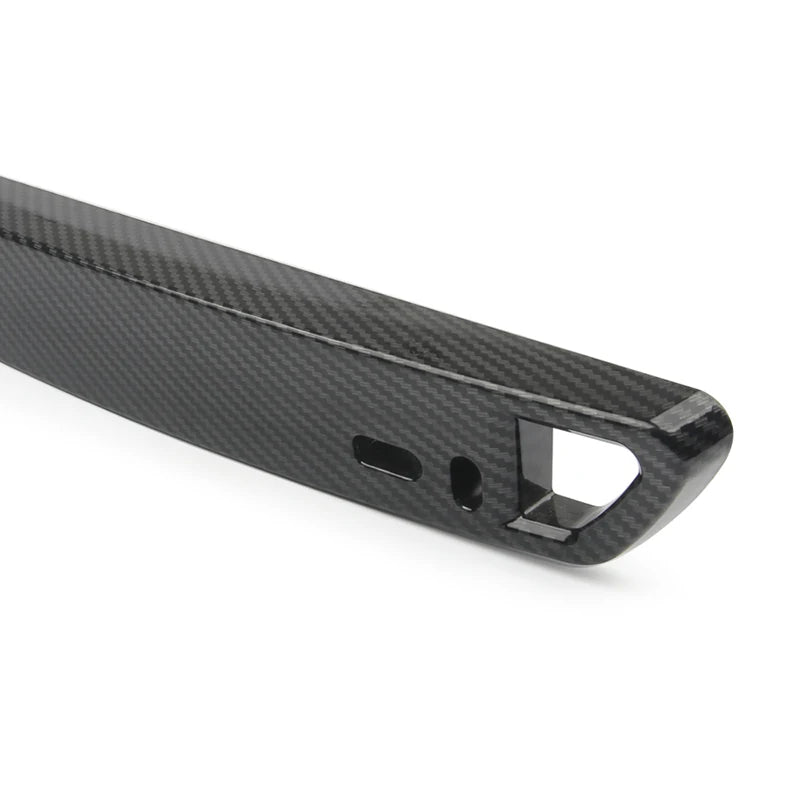 A black carbon fiber adjustable universal car license plate holder with a rectangular opening.
