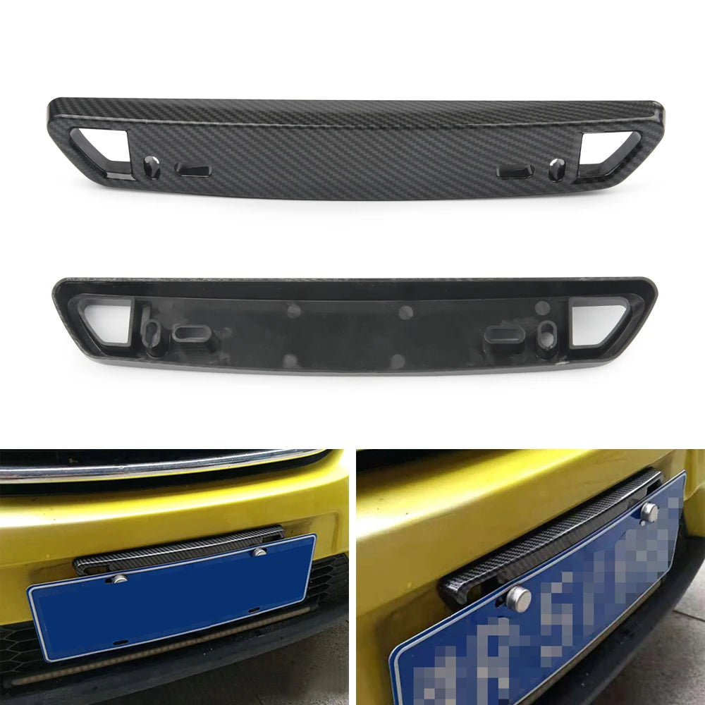 Black adjustable universal car license plate holder shown in close-up and installed on a yellow vehicle.