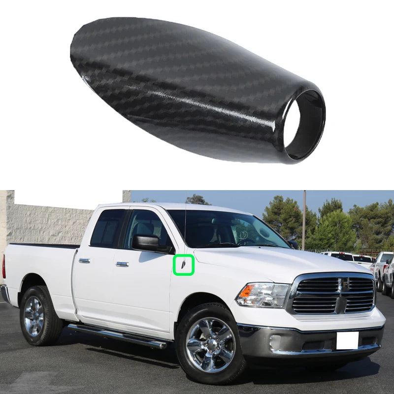 Carbon fiber look antenna base trim for a white Dodge RAM pickup truck.