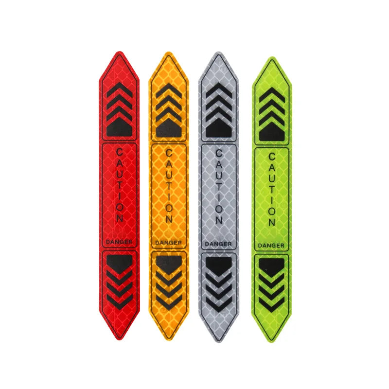 Cinq autocollants de sécurité réfléchissants verticaux rouges, oranges, gris et verts avec des symboles en chevron noirs.