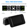 A black portable solar tire pressure monitoring system with an LCD display showing tire pressure, temperature, and battery st