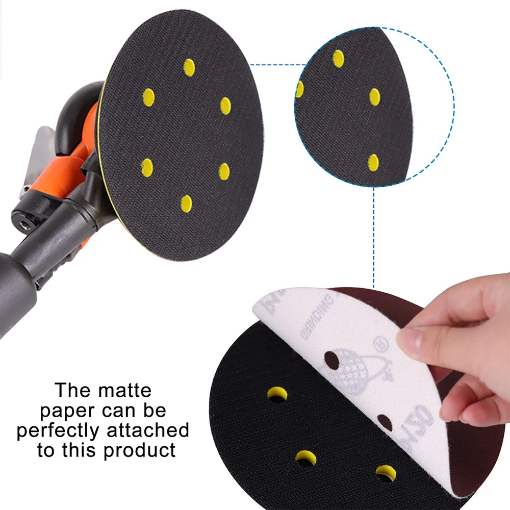 A black sanding pad with yellow dots is shown being attached to a mini air orbital sander kit.