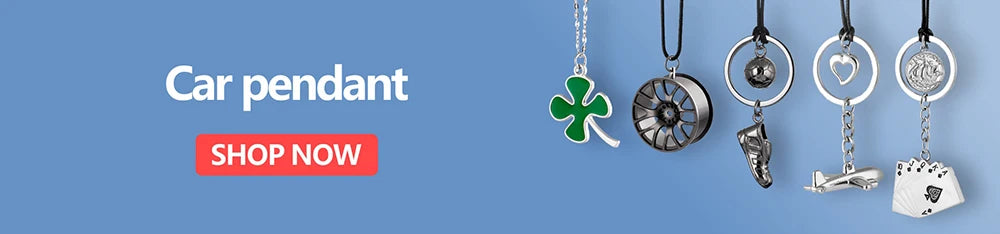 A collection of silver and green car pendants featuring various shapes like a clover, gear, heart, and animal figurine.