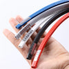 Hand holding various colored car door edge protector trim materials