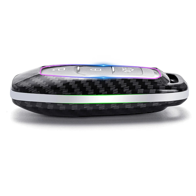 A black car key cover with a carbon fiber texture and illuminated buttons is shown on a white background.