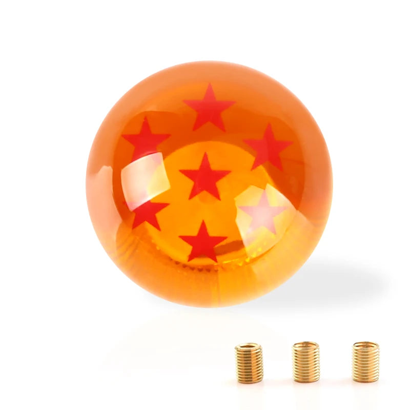 Maneta de cambios naranja brillante con estrellas rojas y detalles de latón.