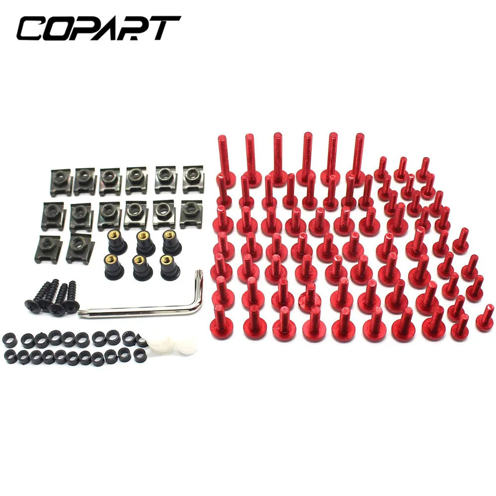 A collection of red motorcycle fairing bolts and various metal hardware components for installation.