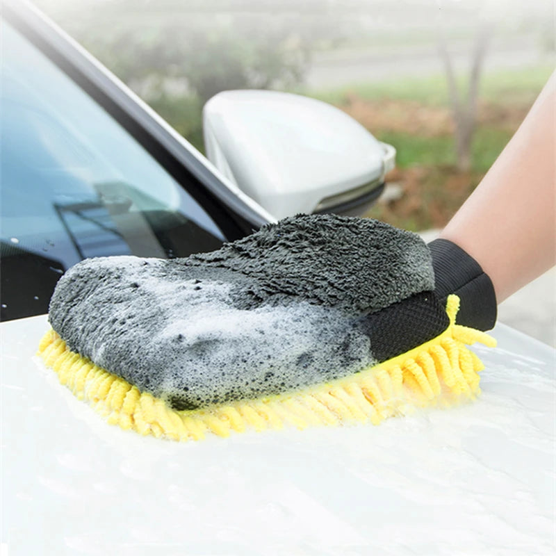 A black and gray microfiber chenille car wash mitt with a yellow scrubbing pad is shown on a white surface.