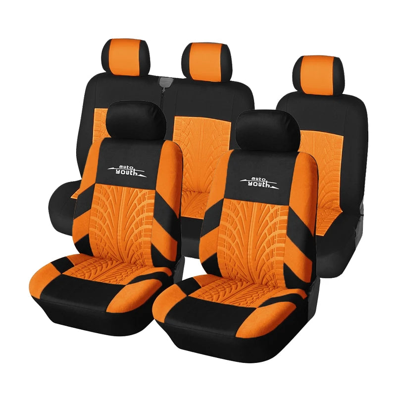 Three black car seat covers with orange accents and auto youth branding shown side by side.