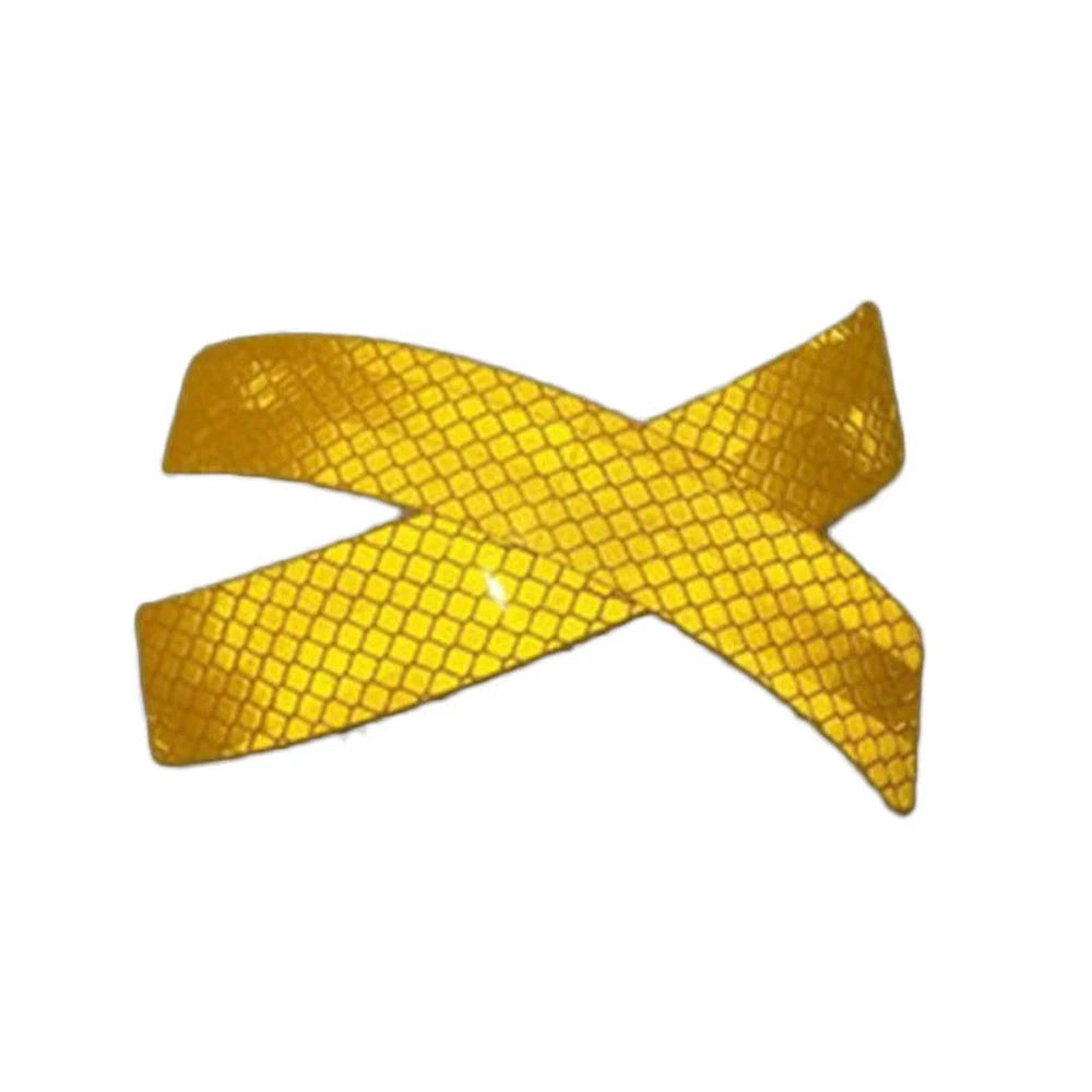 Yellow dual reflective car bumper warning strips forming an 'X' shape.