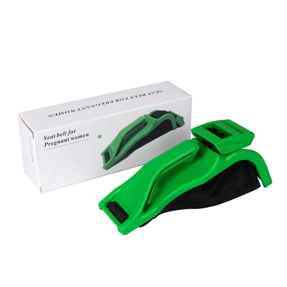 A green adjustable car seat belt for pregnant women is shown next to its packaging box.