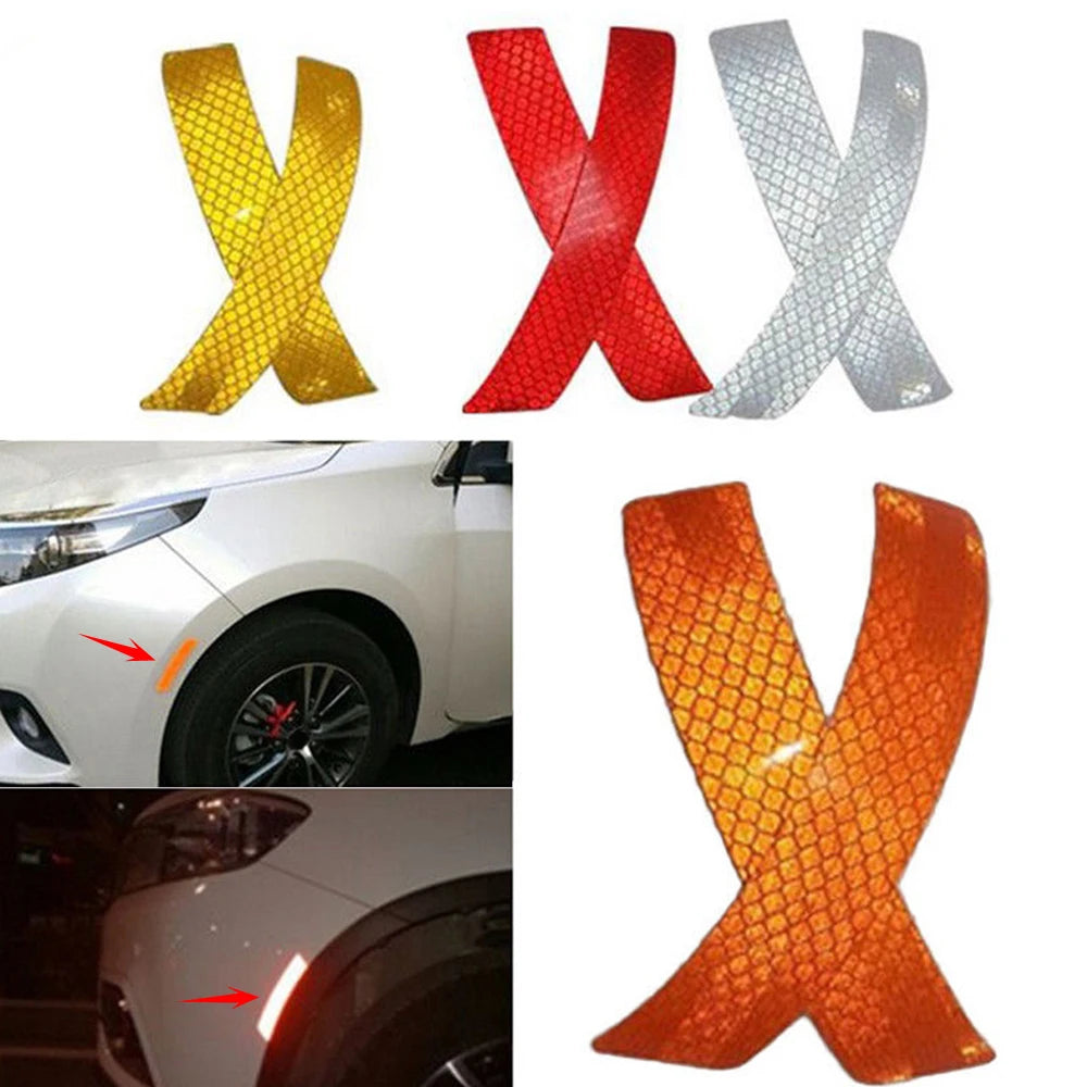 Three reflective X-shaped warning strips in yellow, red, and silver for car bumpers
