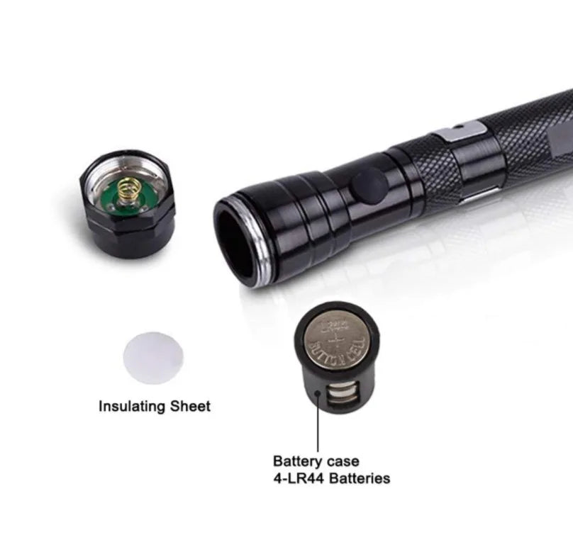 A black magnetic LED flashlight with an insulating sheet and a battery case for 4LR44 batteries.