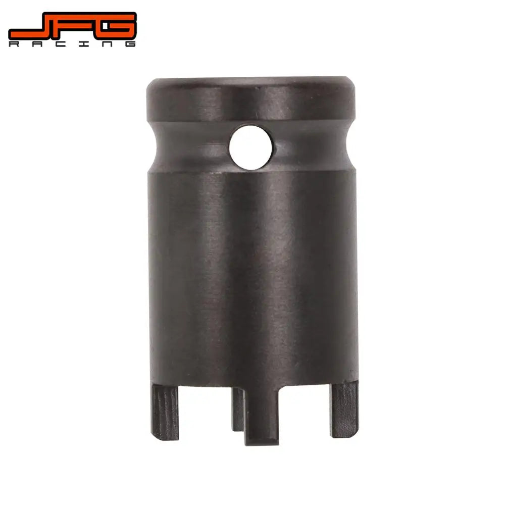 Outil de retrait de écrou pour cadenas de moto noir, avec corps cylindrique et trou circulaire en haut.