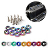 A collection of anodized aluminum fender and bumper hardware, including various sized bolts and mounting rings.
