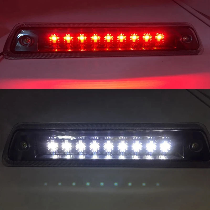 Close-up view of an LED third brake light assembly with multiple bright red lights illuminated.