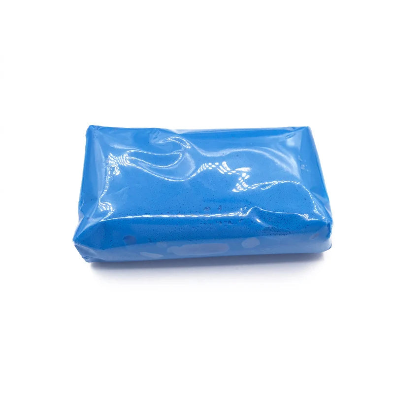 A rectangular bar of blue magic clay used for auto detailing