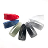 A collection of various colored and silver car shark fin antenna covers displayed against a white background.