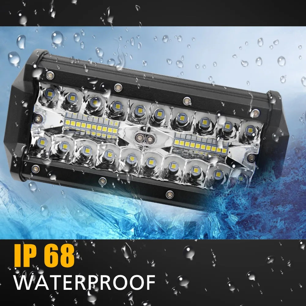 A black LED work light bar with multiple bright lights is shown being sprayed by water droplets, highlighting its IP68 waterp
