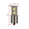 Vista cercana de una bombilla indicadora LED blanca cálida de alto rendimiento con base de metal y múltiples fuentes de luz.
