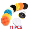 A set of 11 orange, yellow, and black car polishing sponges for wax and seal.